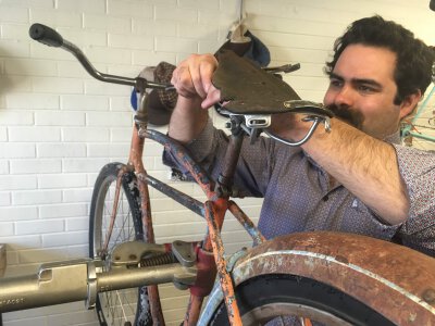 Sopris Sun Editor Works on an Antique Bike